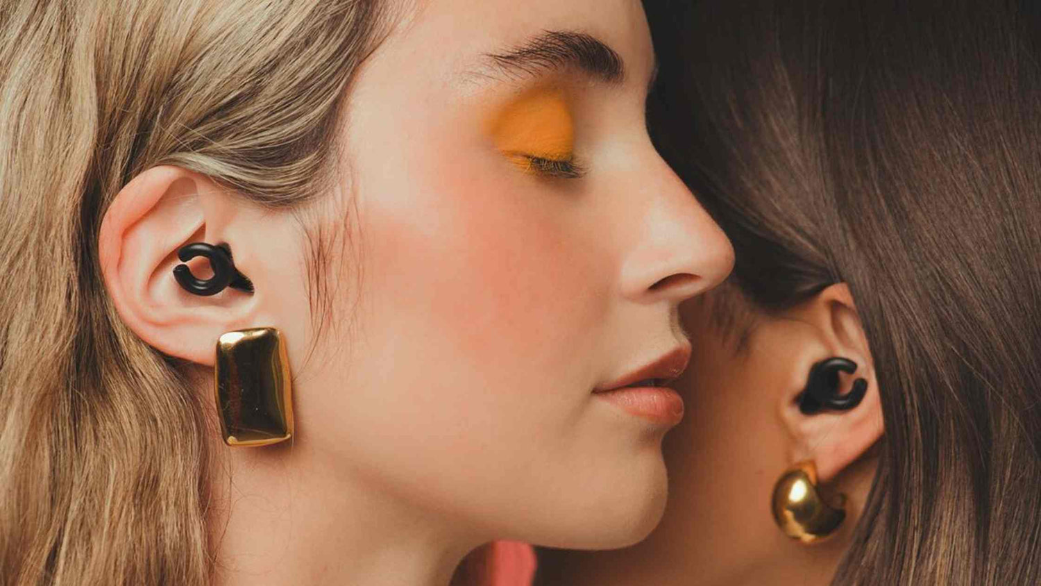 Ladies wearing HEAR Hush Hoops by Apothecary Products
