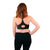 Back of woman wearing black racerback nursing bra