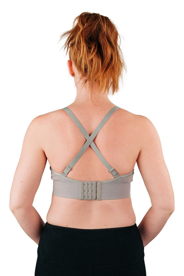 Back of woman wearing grey bra for everyday wear with straps crossed