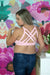 Side of woman wearing pink strappy nursing bra