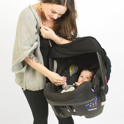Black nursing cover being used as a carseat cover